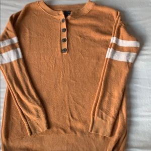 Henley style gold varsity stripe sweater